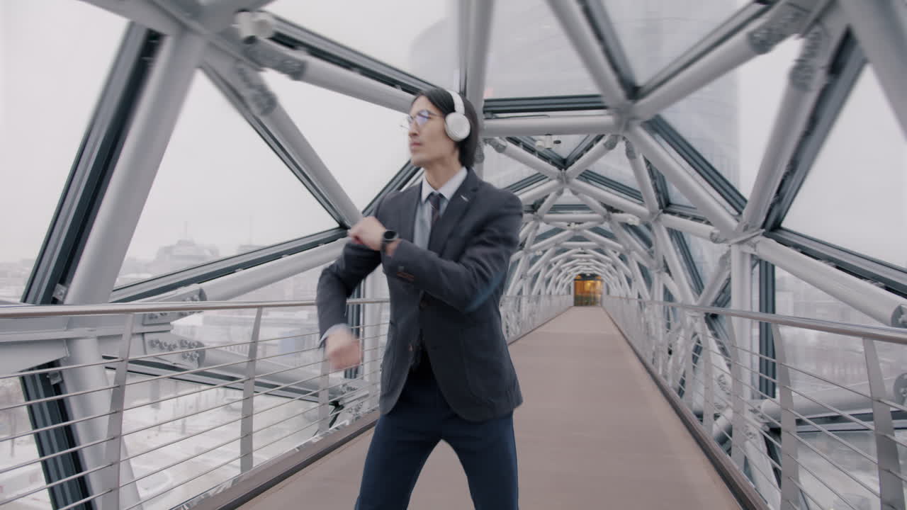 Businessman Dancing on a Modern City Bridge