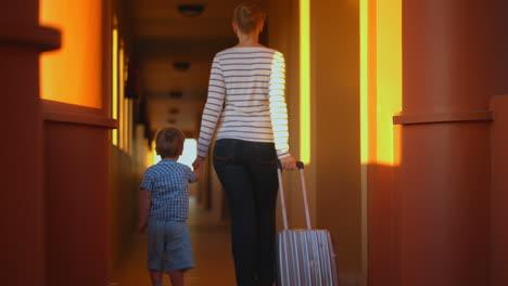 mother with son leaving the hotel