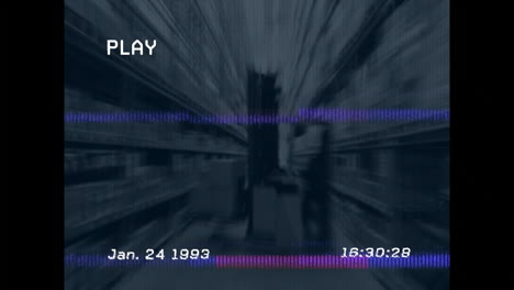 in warehouse, blurred aisle with timestamp and play text overlay, showing animation