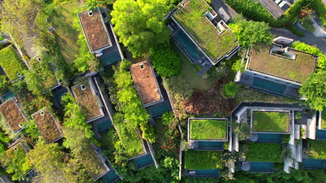 Nested-Group-of-Small-Private-Villas-on-Hilltop-at-Maua-Nusa-Penida-Resort-in-Bali-Indonesia---Aerial-Flyover-Top-Down-View