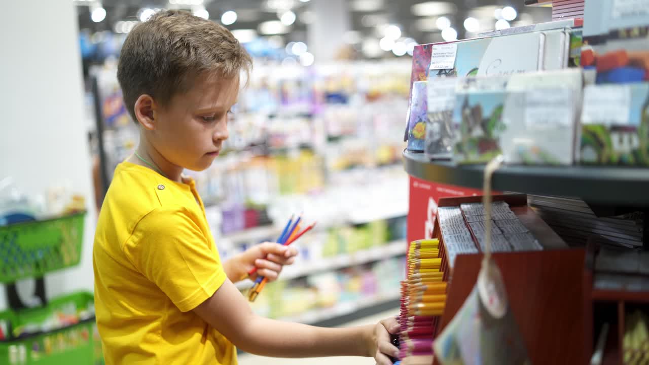 Buying stationery for school. Boy buying school supplies, back to school