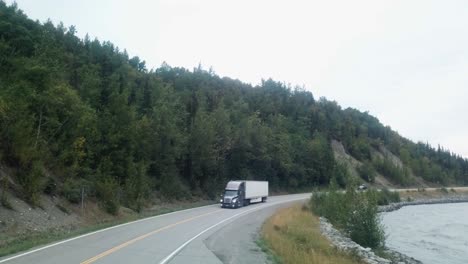 View-along-the-Glenn-Highway-and-the-Matanuska-River-in-the-Chugach-Mountain-Range-of-central-Alaska-on-a-cloudy-summer-day