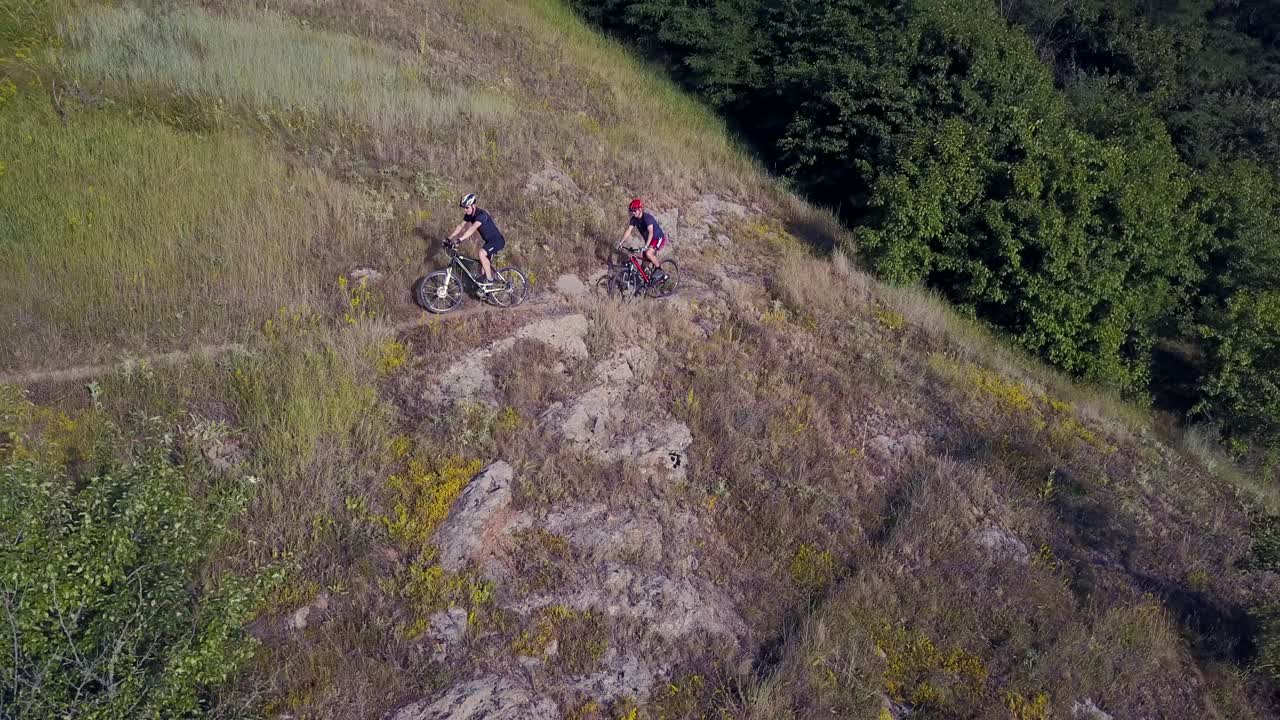 Men Riding A Bike. Men riding a bike and looking at landscape