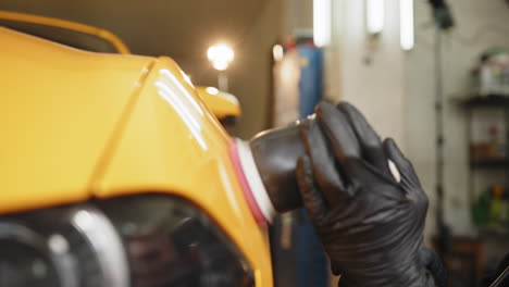 car paint polishing in a garage