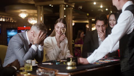 people playing poker at the casino.