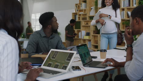 young african american business people meeting software developer team design mobile application colleagues brainstorming sharing creative ideas using tablet computer collaborating in startup office