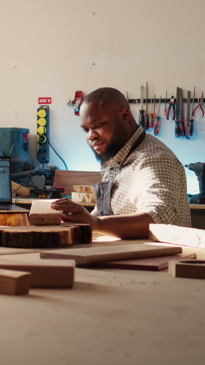 Smiling African American Carpenter Working on Wood in Workshop