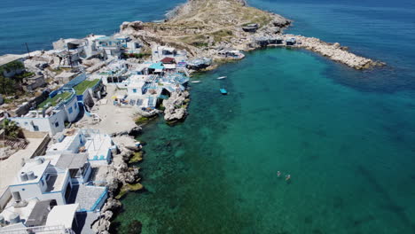 aerial shot over rocky coastline in tahet al reeh, anfeh, lebanon