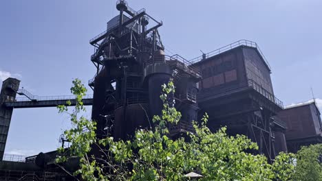 steel-blast-furnace-between-nature-in-duisburg-landscape-park,-germany