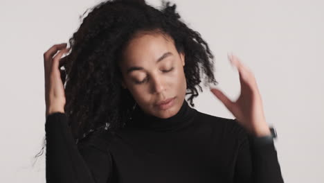 African-american-woman-preening-over-white-background.