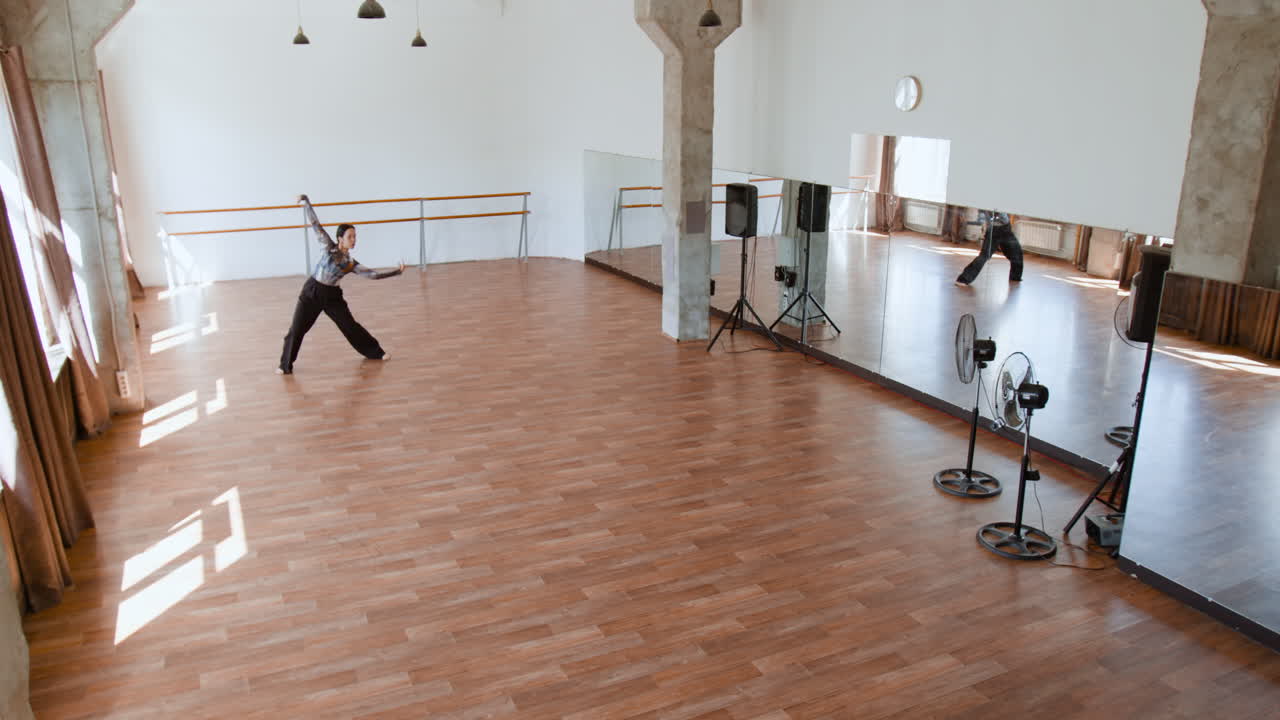 Dynamic Dance Rehearsal in a Spacious Studio