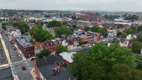 aerial drone footage of small city intersection on a foggy day