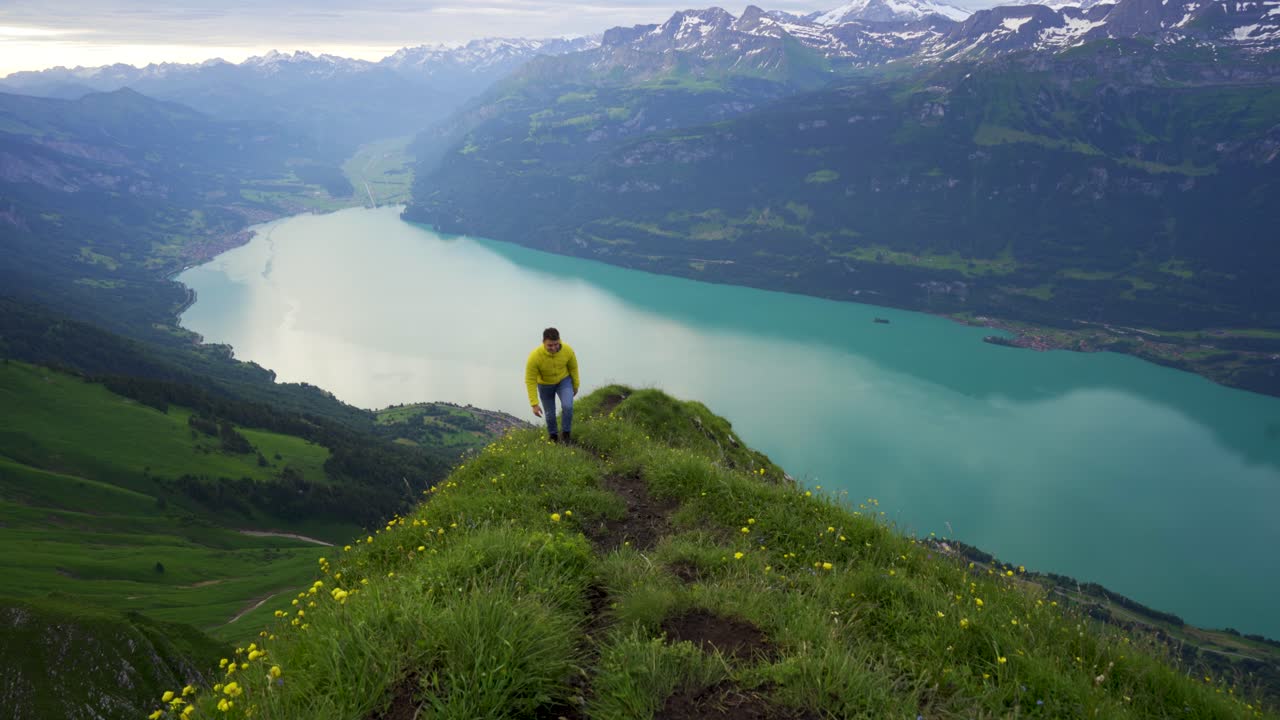 Man Hikes Up Trail On Scenic Swiss Mountain, Lake Brienz, Emmental Alps
