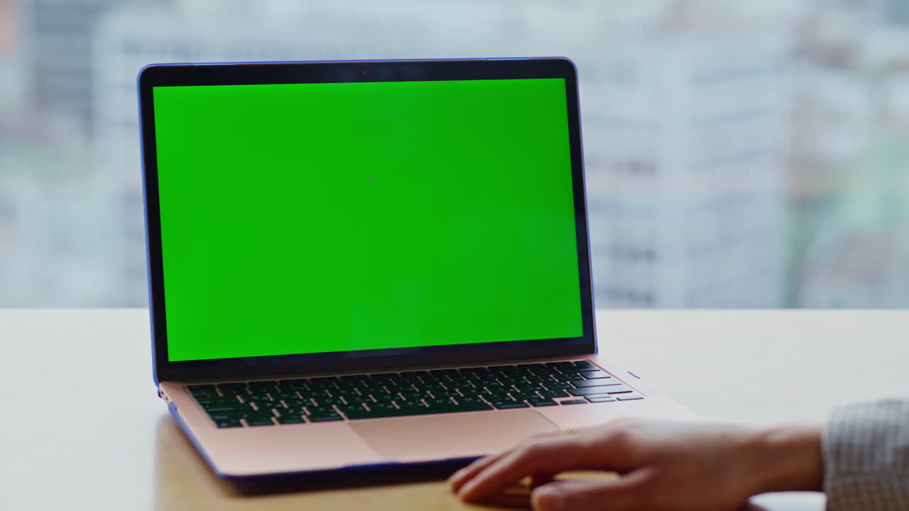 Unknown woman watching chromakey computer in panoramic cityscape office closeup