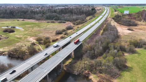 aerila shot, the highway bridge crosses the river minija , cars run on the highway.