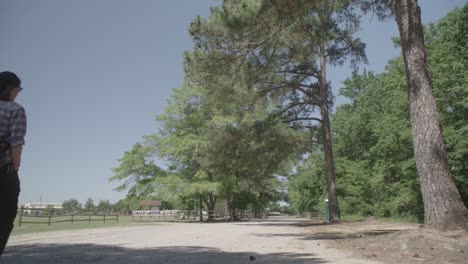 a man walking down a path in a park