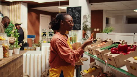 vegan person searching for freshly harvested vegetables from crates