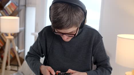 teenager playing retro video game and dancing