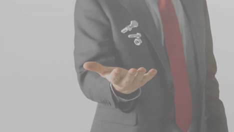 animation of midsection of businessman throwing and catching nuts and bolts