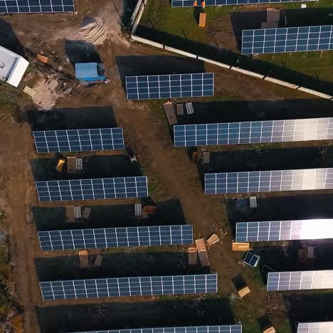 solar panels in field. renewable energy, technology, electricity, service, green power. view from above. video from drone