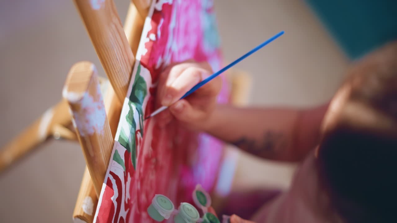 Artist Moves Purposefully, Creative Individual Passionately Reaches Towards Canvas With Force, Artistic Creator Deliberately Extends Their Limb With Vigorous Purpose And Unwavering Focus