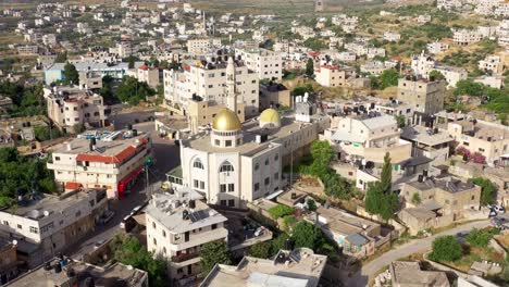 aerial view over hamas golden dome mosque in palestine town biddu,near jerusalem