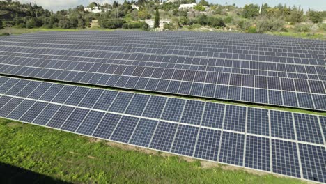 long rows of solar panels on big solar farm