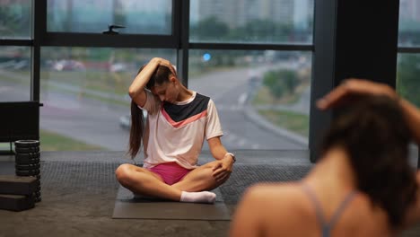 woman stretching in a gym