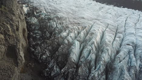 ice formations under volcanic hills in highlands of iceland