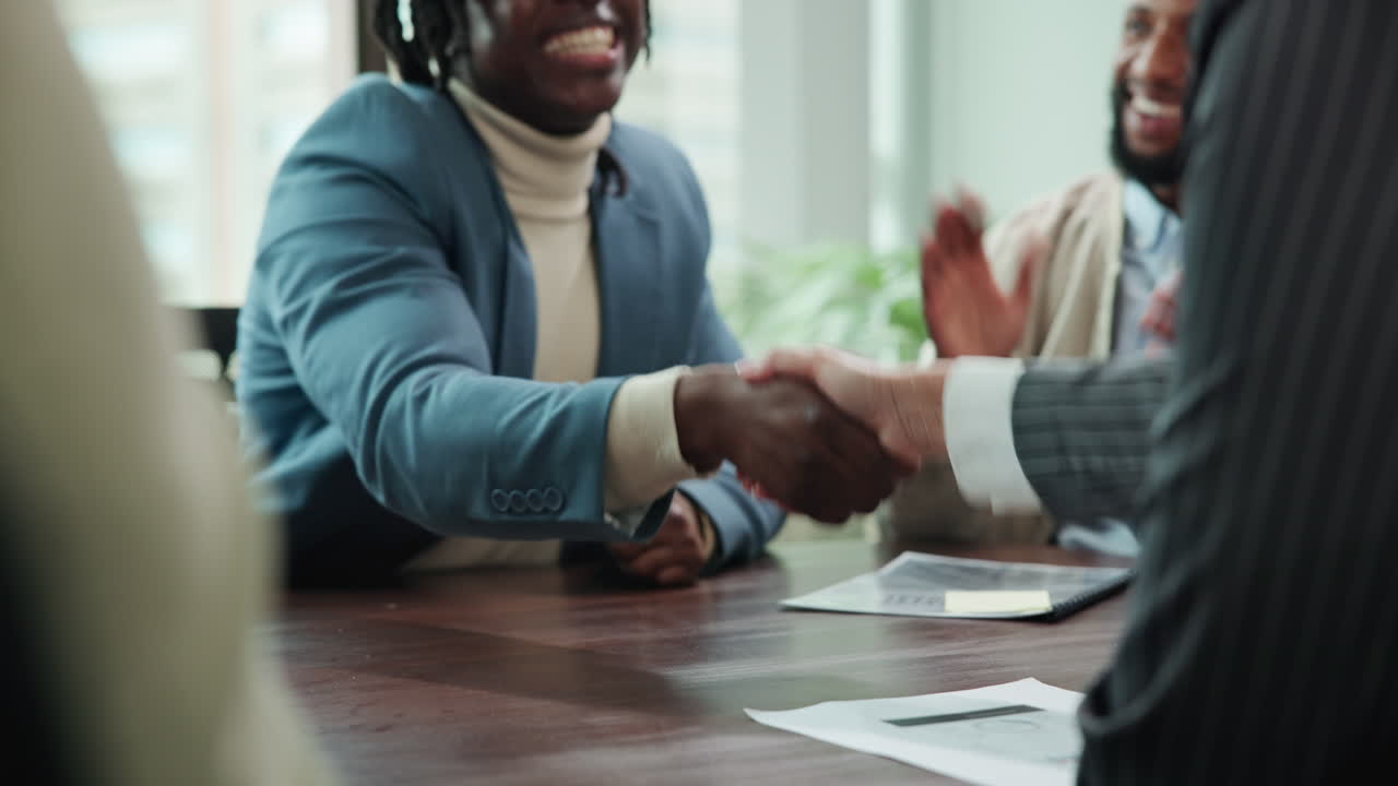Business people shaking hands in a meeting