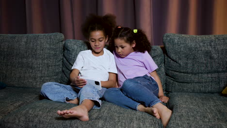 kids sitting on the sofa at home