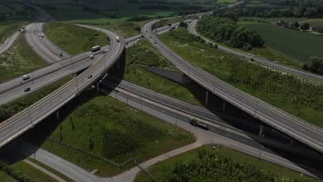 Timelapse-Motorway-Junction-UK-Catthorpe-Interchange-M6-M1-A14-Roads-Travel-Transportation-Aerial-View