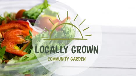 animation of locally grown text in green, over bowl of fresh salad on white wooden boards