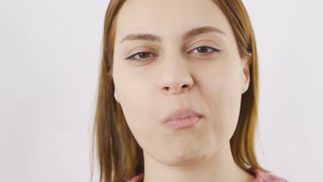 close-up of woman eating dragee. eating chocolate.