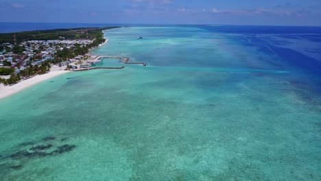 panoramic aerial push in towards exquisite maldives coast