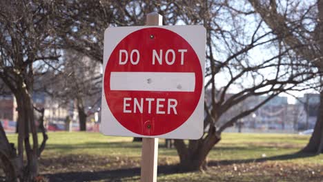 car and vehicle sign discouraging entrance one way road in outdoor setting