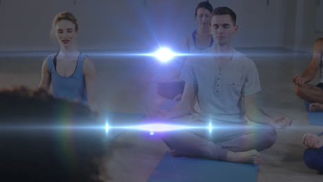 animation of glowing light over people practicing yoga