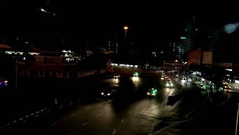 Watching-the-cars-on-the-victory-monument-in-Bangkok-at-night