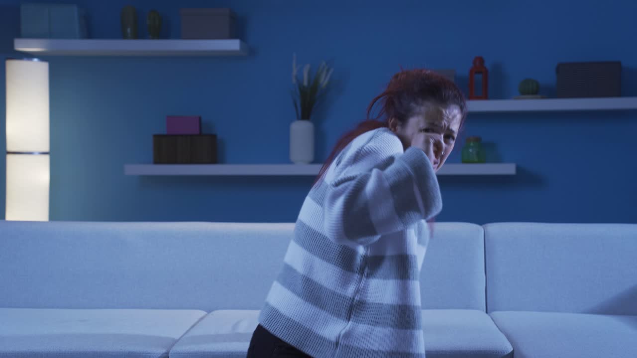 Woman looking at camera with coward expression.