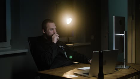 man working in the hut at night