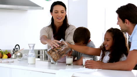 mother giving cookies to her family