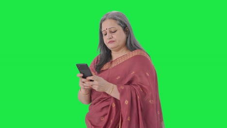 Indian-old-woman-chatting-on-phone-Green-screen