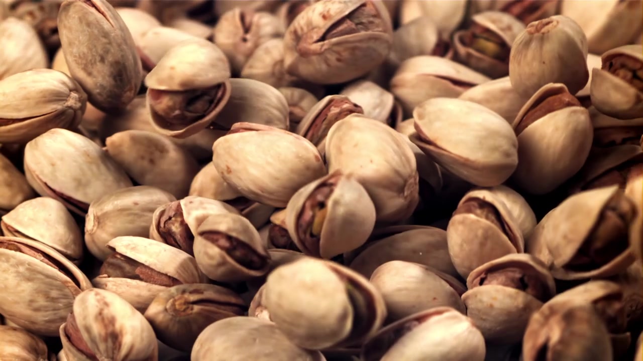Pistachios Falling and Piling Up in a Close-up Shot