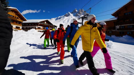 group of people walking on a snowy mountain slope