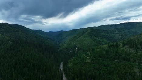 aerial view of river between forests in missoula county, montana - drone shot