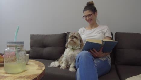 young woman with cute dog at home