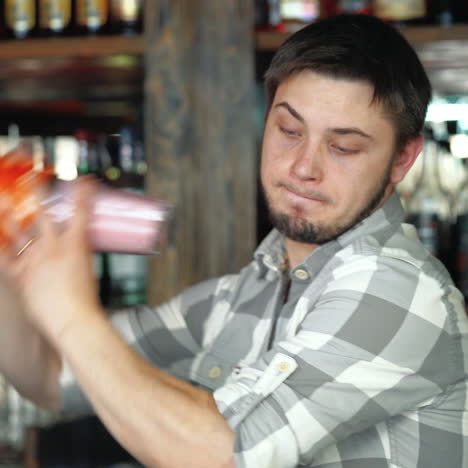 barman at work, preparing cocktails. shaking cocktail shaker. ?oncept about service and beverages. sqare video