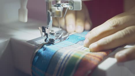 sewing machine stitches fabric with precision as needle moves with speed