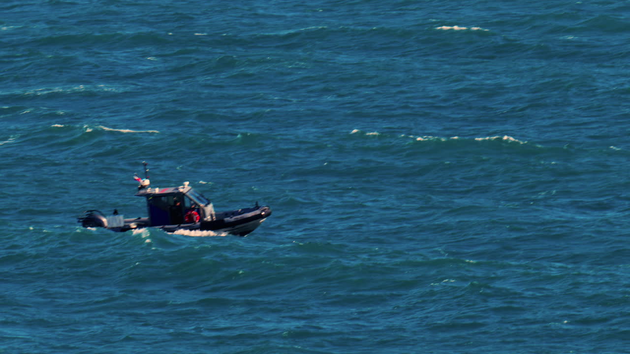 Nice, France - March 17, 2025: Small boat moving on the blue sea in daylight