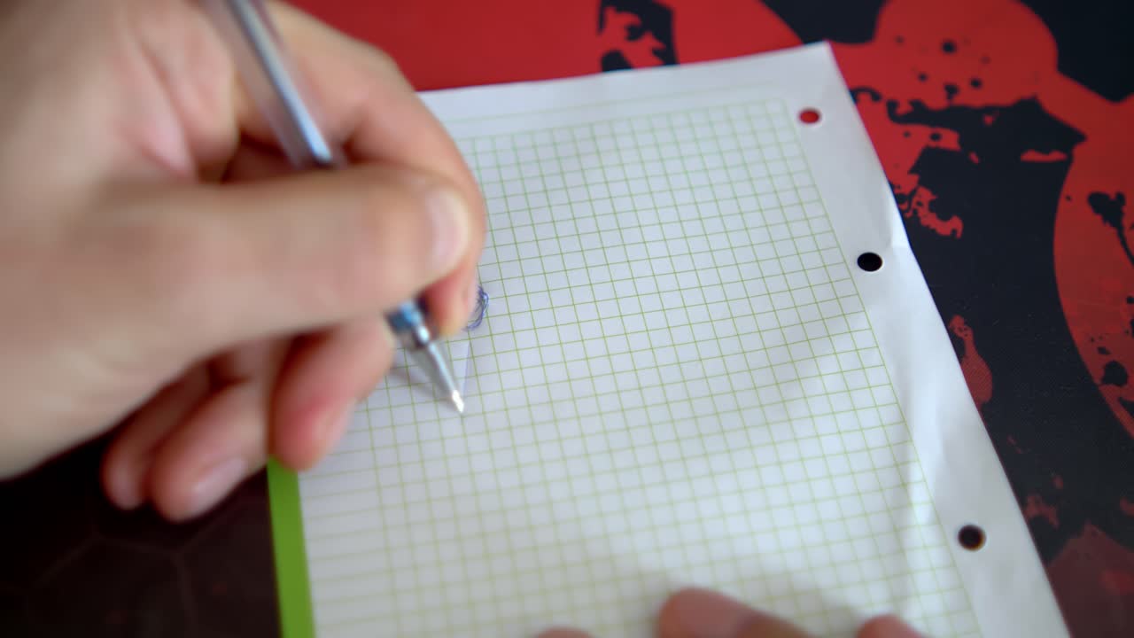 A pen creates letters on grid paper. The writing process is showcased against a vibrant, patterned backdrop